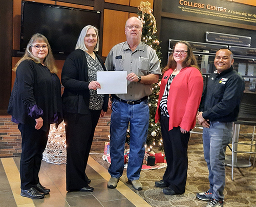 Northeast in South Sioux City contributes $500 to Cardinal Christmas Baskets